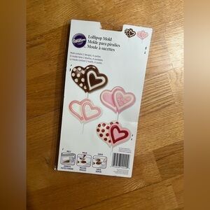 Wilton Heart Lollipop Mold with Pink and Brown Designs